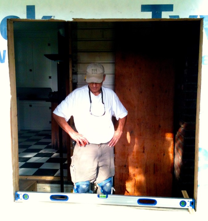 Mr. H.C. frowning at the level.