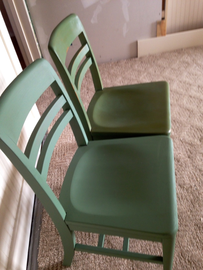 The far chair has had a coat of regular wax and a coat of dark wax. The other chair has only been painted.