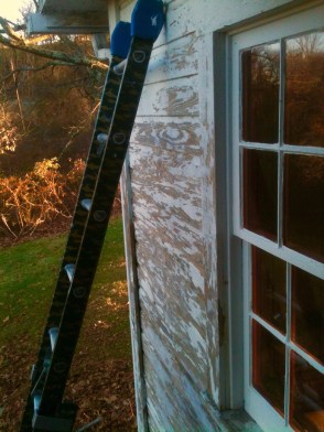 ladder on unpainted house