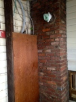 ugly chimney and panel box in mudroom
