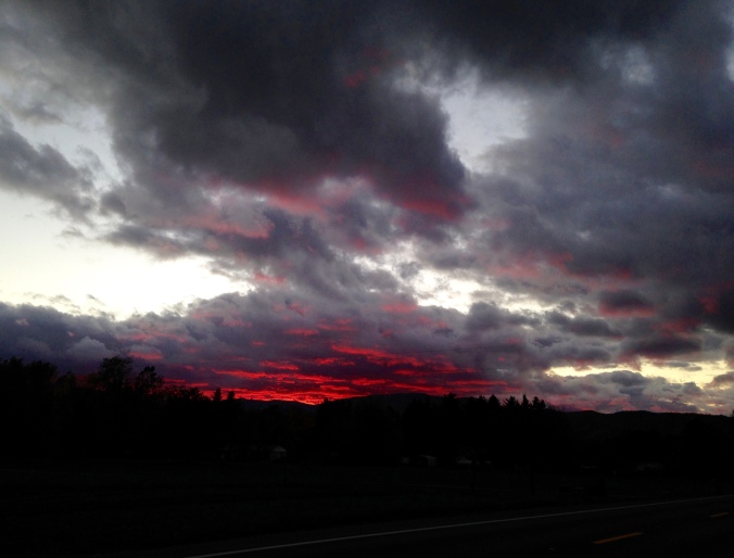 black clouds, red sunset